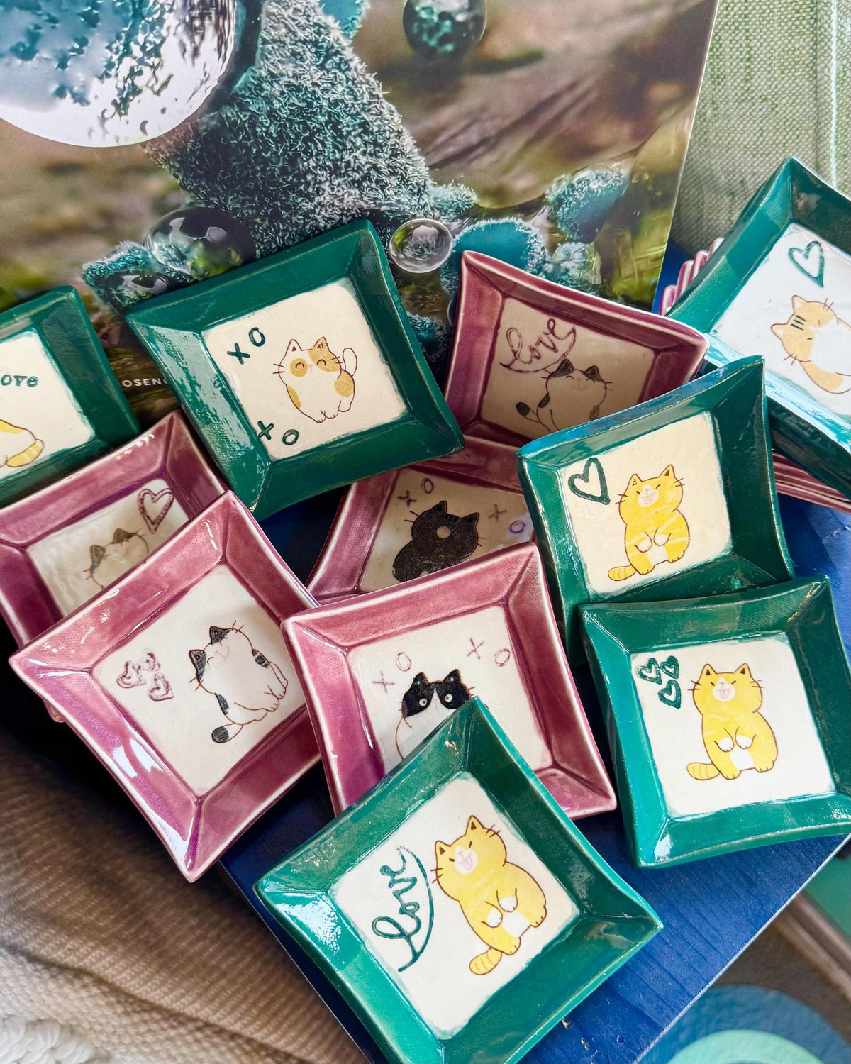Small ceramic cat tray used as a whimsical catchall