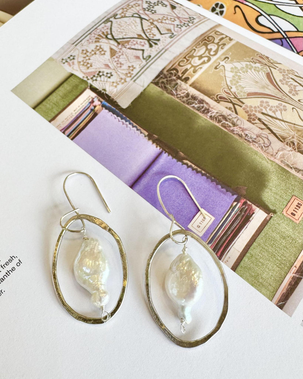 Natural pearl and hand-formed sterling silver hoop earrings, made in Kansas and curated by A STORE NAMED STUFF. Artists originals using reclaimed sterling.