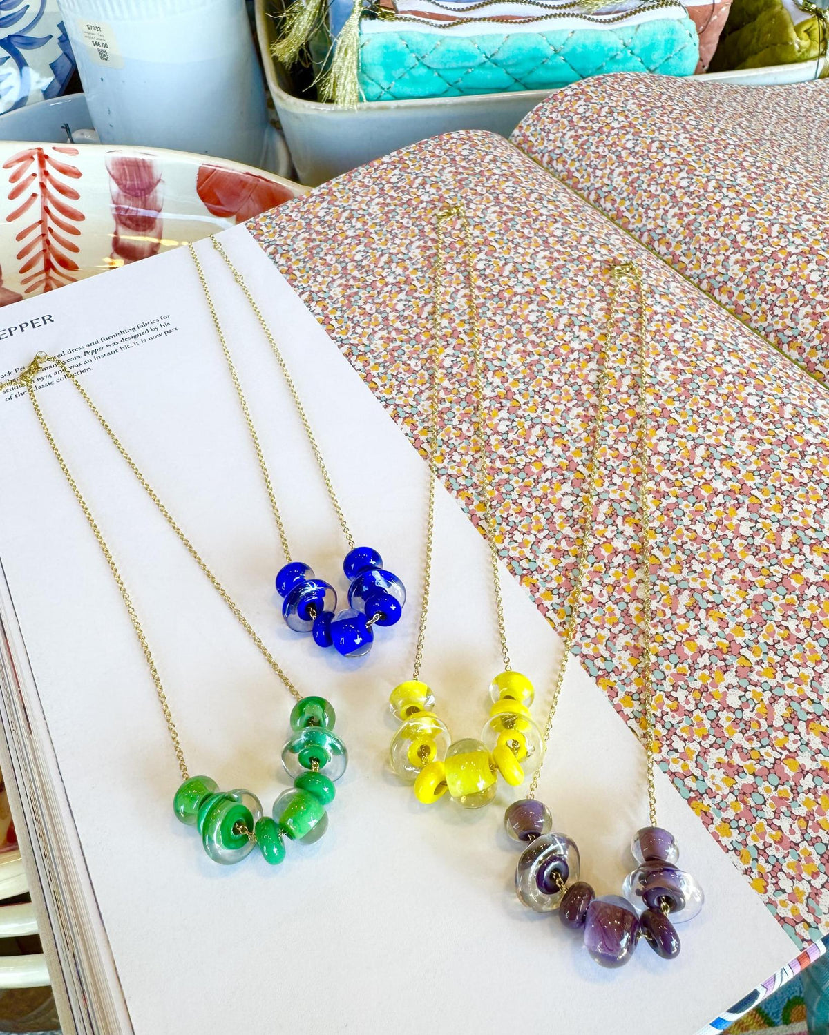 Lifesaver Glass Bead Necklaces

The graduated sizes and varied shapes of these playful “Lifesaver” beads create wonderful movement when worn. Some designs feature joyful monochromatic color combinations, while others mix vibrant colors for a more expressive, energetic look. Each necklace has its own personality, from softly coordinated to bright and unexpected.