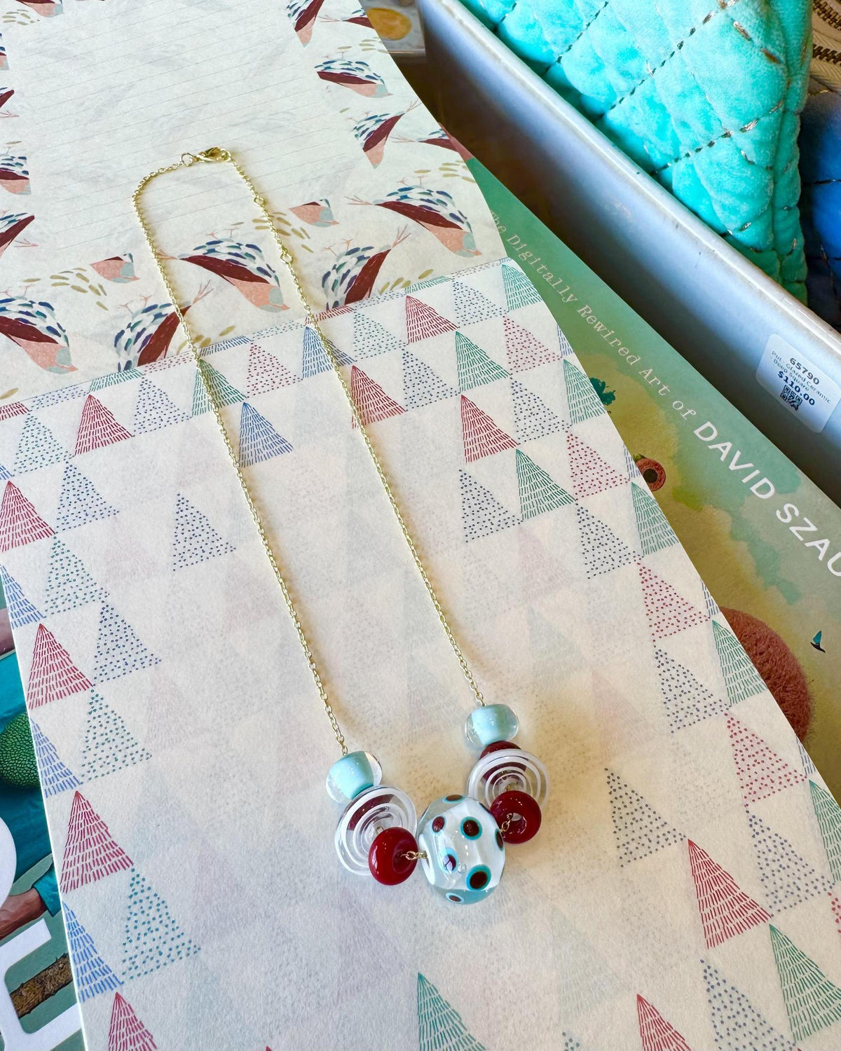 “Statement” Lifesaver Glass Bead Necklaces

The “Statement” necklaces are the most dramatic expression of our playful Lifesaver Series. Each one features an especially large, intricately designed key element bead that serves as the centerpiece of the necklace. These impressive focal beads are even more substantial and detailed than the “Fancy” beads, creating a bold presence while still maintaining the joyful spirit of the collection.

The graduated sizes and varied shapes of the surrounding Lifesaver beads