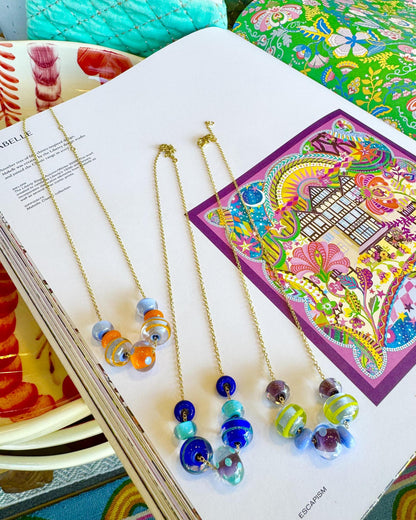 “Fancy” Lifesaver Glass Bead Necklaces

The “Fancy” necklaces are part of our playful Lifesaver Series, featuring more intricately designed key element beads that add an especially artful touch to each one-of-a-kind piece.

The graduated sizes and varied shapes of the Lifesaver beads create beautiful movement when worn. Some necklaces feature joyful monochromatic color combinations, while others mix vibrant colors for a more energetic, expressive look. Within each design, the intricate “Fancy” beads serve a