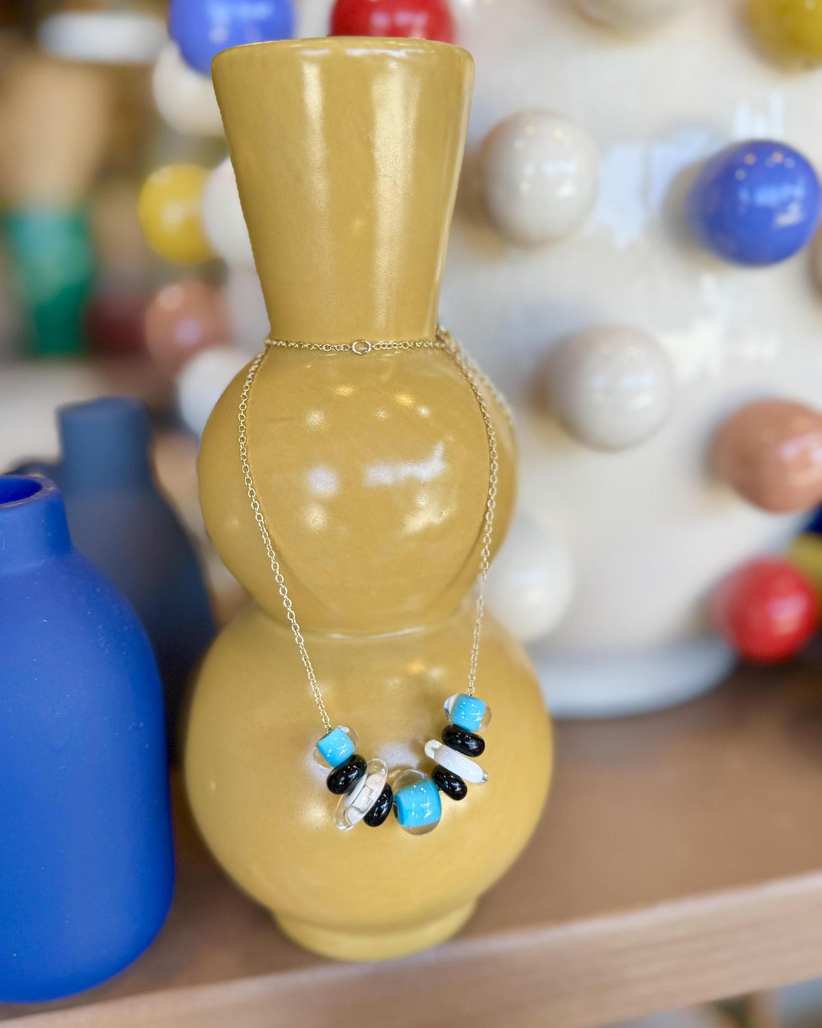Lifesaver Glass Bead Necklaces

The graduated sizes and varied shapes of these playful “Lifesaver” beads create wonderful movement when worn. Some designs feature joyful monochromatic color combinations, while others mix vibrant colors for a more expressive, energetic look. Each necklace has its own personality, from softly coordinated to bright and unexpected.