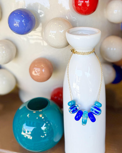 “Fancy” Lifesaver Glass Bead Necklaces

The “Fancy” necklaces are part of our playful Lifesaver Series, featuring more intricately designed key element beads that add an especially artful touch to each one-of-a-kind piece.

The graduated sizes and varied shapes of the Lifesaver beads create beautiful movement when worn. Some necklaces feature joyful monochromatic color combinations, while others mix vibrant colors for a more energetic, expressive look. Within each design, the intricate “Fancy” beads serve a