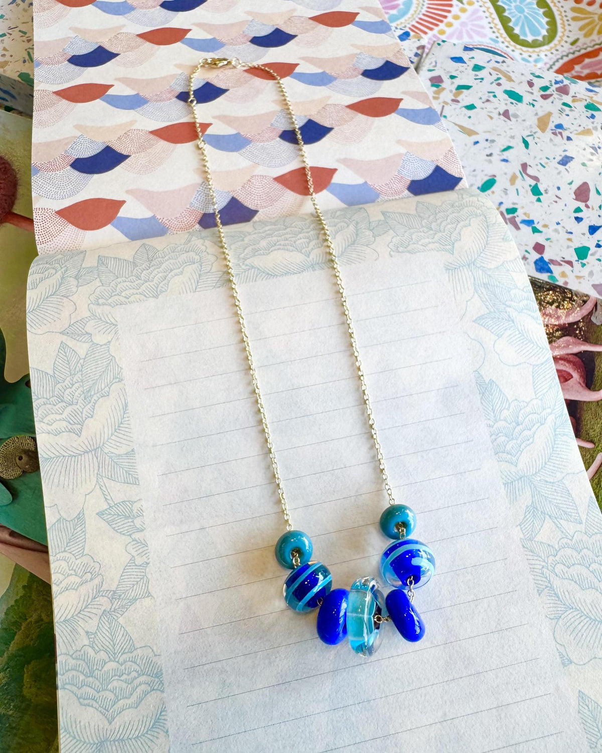 “Fancy” Lifesaver Glass Bead Necklaces

The “Fancy” necklaces are part of our playful Lifesaver Series, featuring more intricately designed key element beads that add an especially artful touch to each one-of-a-kind piece.

The graduated sizes and varied shapes of the Lifesaver beads create beautiful movement when worn. Some necklaces feature joyful monochromatic color combinations, while others mix vibrant colors for a more energetic, expressive look. Within each design, the intricate “Fancy” beads serve a