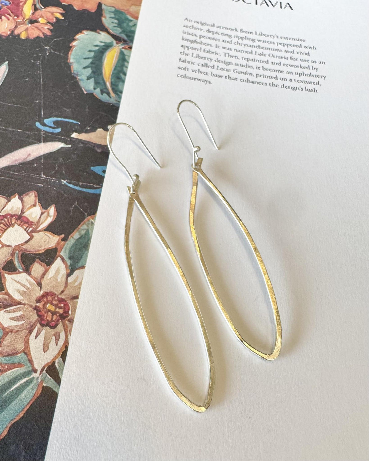 Elongated sterling silver oval earrings with hand-formed texture, made in Kansas and curated by A STORE NAMED STUFF. Artist made using reclaimed sterling.
