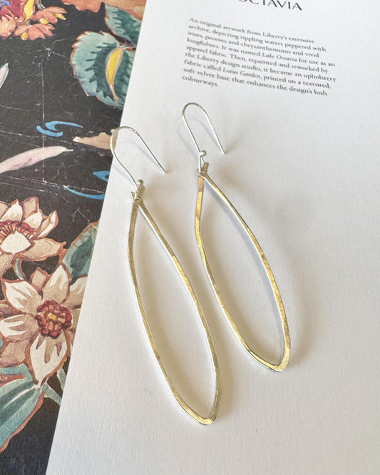 Elongated sterling silver oval earrings with hand-formed texture, made in Kansas and curated by A STORE NAMED STUFF. Artist made using reclaimed sterling.